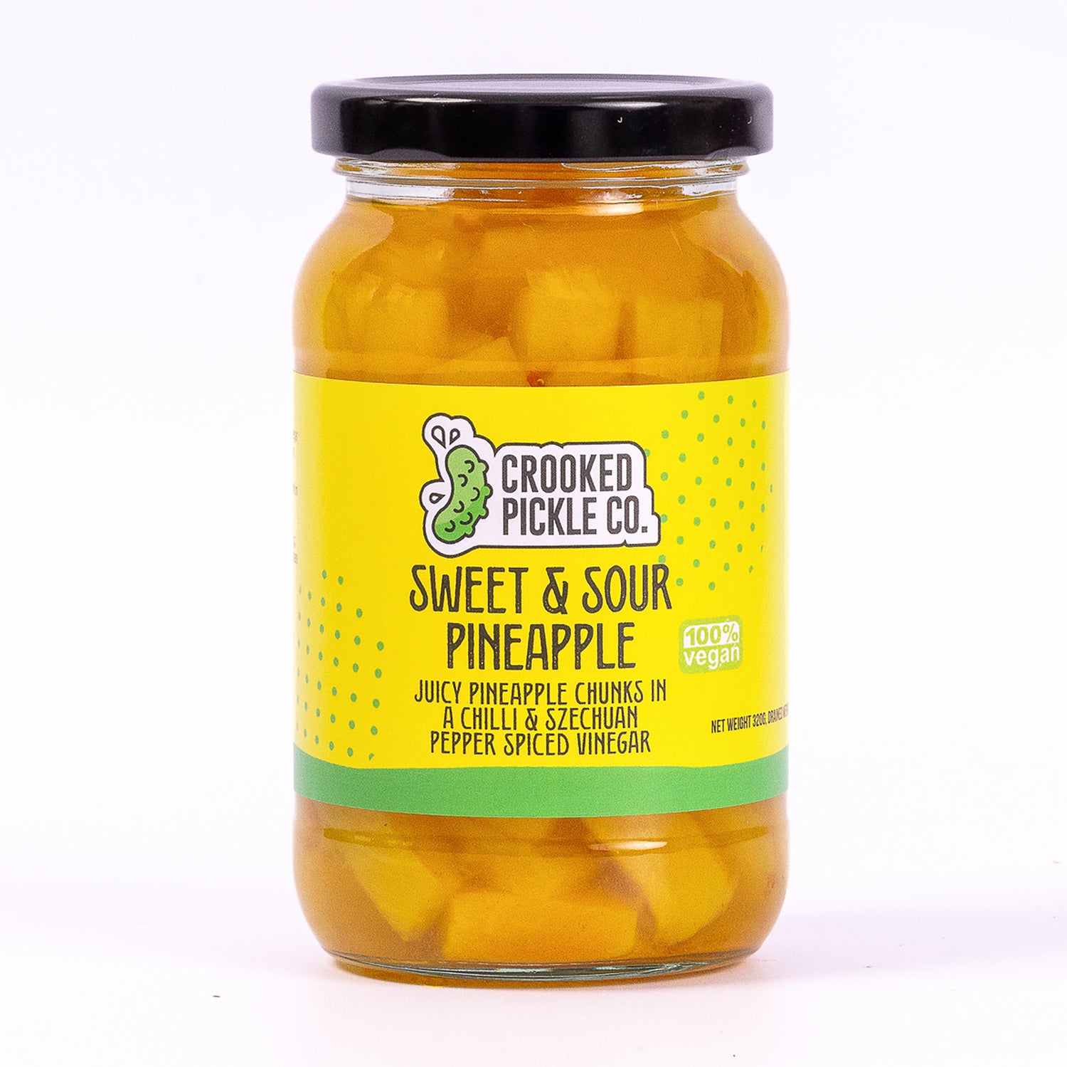 Pineapple pickles in a jar with chilli and szechuan pepper. Cheese pickle and Asian food condiment.